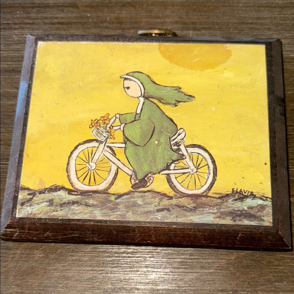 Flavia Weedn 1969 Nun Riding a Bicycle print mounted on 10x13 wood